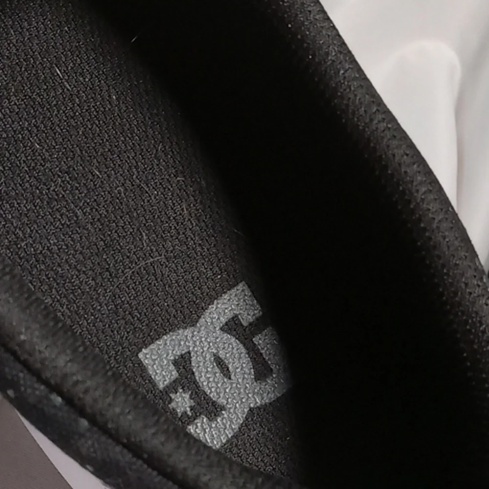 DC SHOES canvas slip on all over logo skate shoes